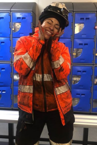 women in mining, ladies hi vis orange and navy jacket and orange hi vis vest